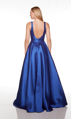 Blue formal dress with a plunging neckline and pockets.