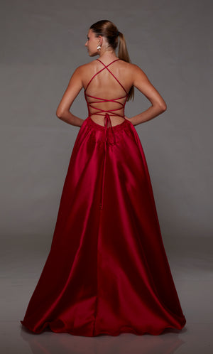 Red mikado ball gown with lace corset, strappy back, and slight train for an stylish and vibrant look.