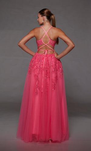 Pink prom dress: sheer corset bodice, full tulle skirt with front slit, lace-up back, and intricate floral lace appliques for an enchanting look.