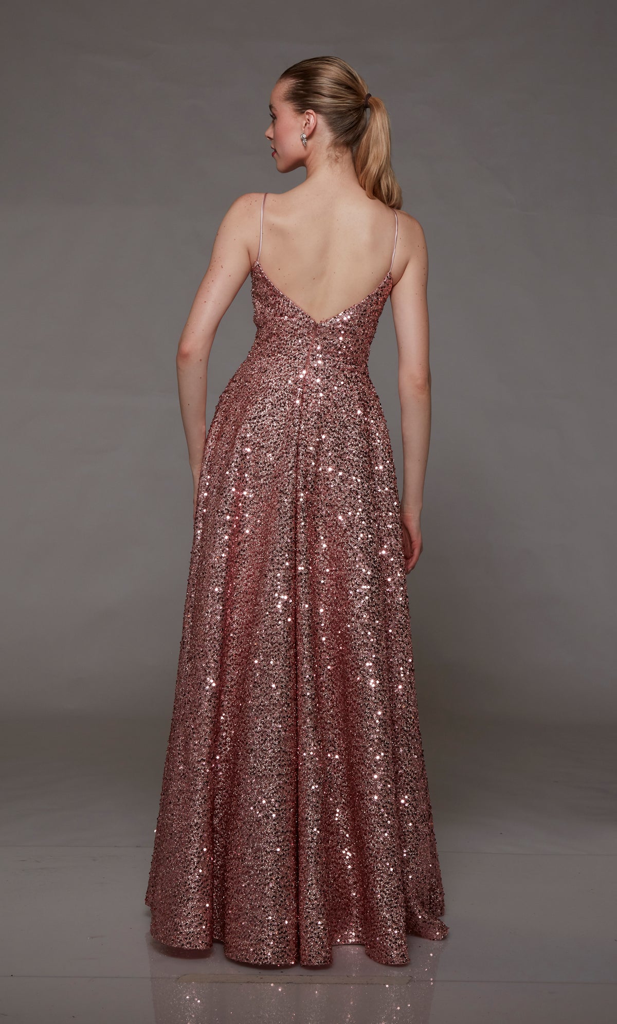 Pink sequin designer dress: A-line silhouette, pockets, V-neckline, and an chic V-shaped back for an stylish and glamorous look.