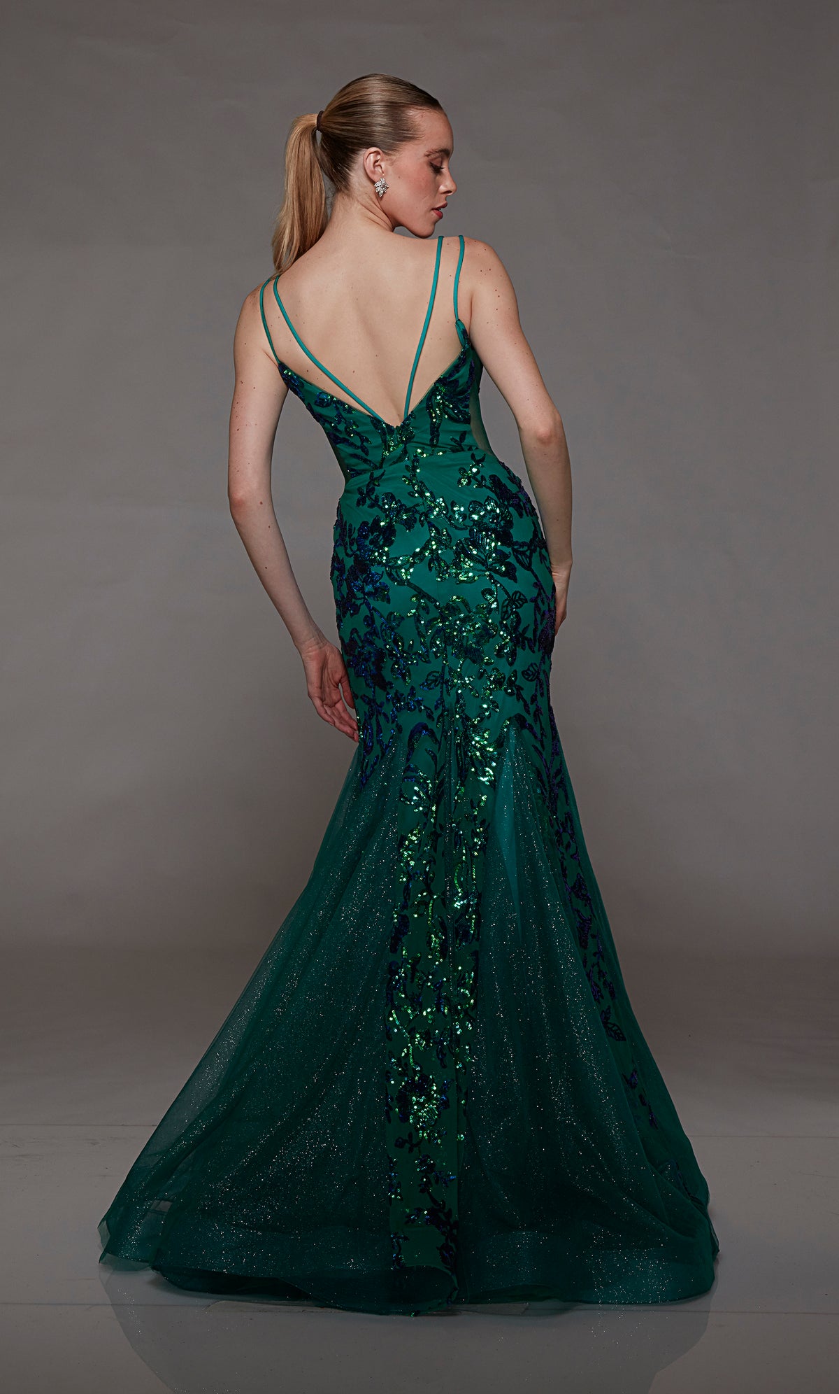 Pine green mermaid dress: Plunging neckline, sequin flowers, sheer side cutouts, and dual straps for an stunning and sophisticated look.