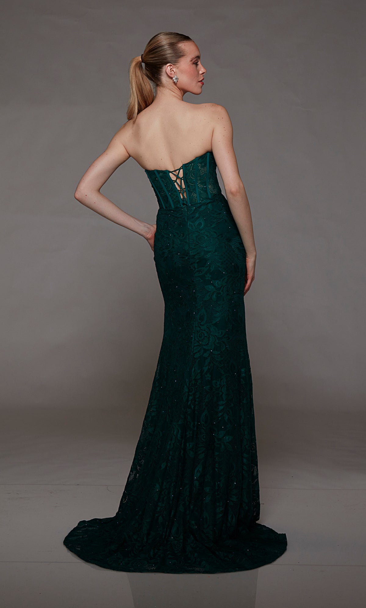 Green lace strapless corset dress: High slit, lace-up back, and an graceful train for an bold and stylish statement.