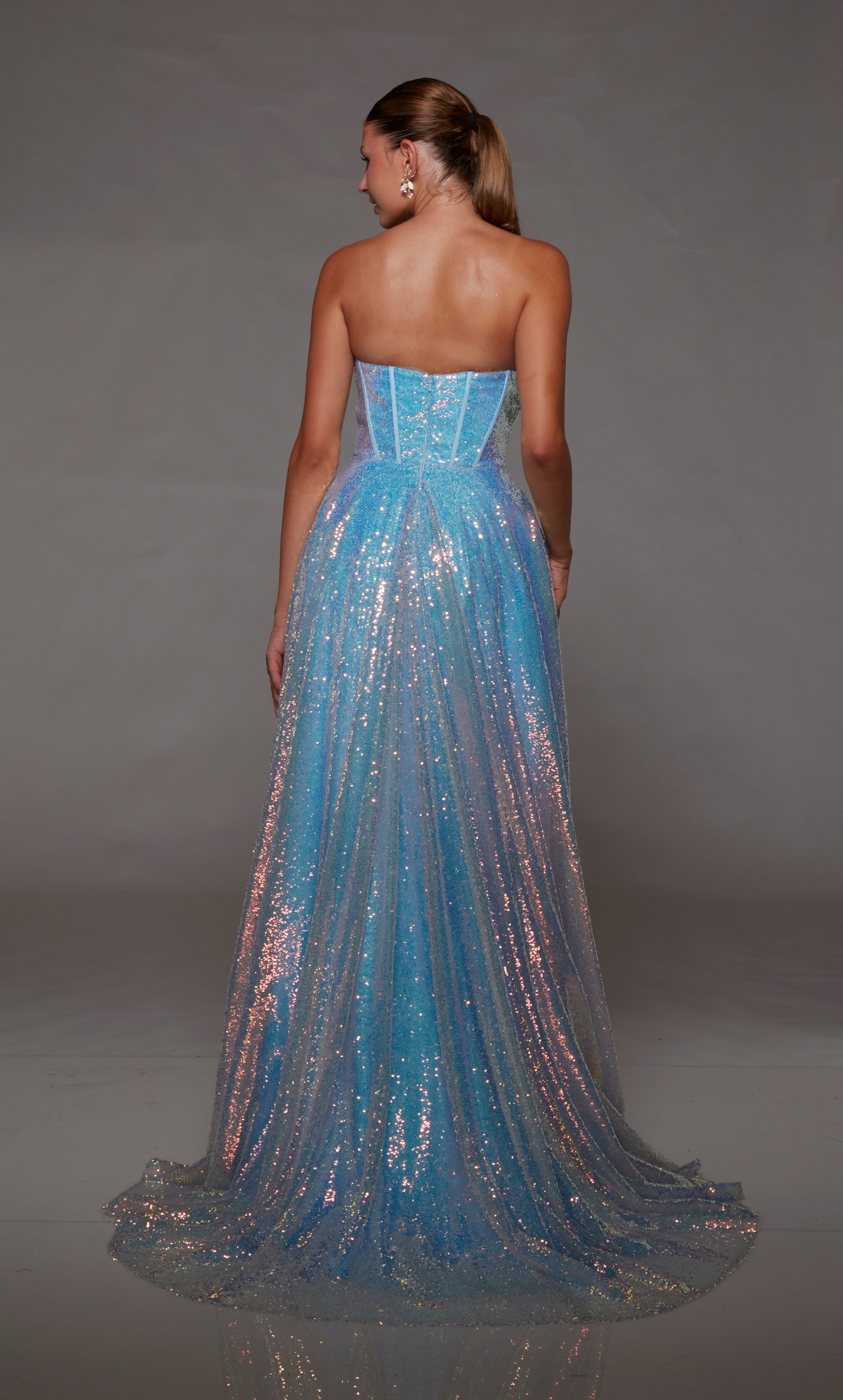 Iridescent sequin ice blue prom dress: Corset bodice, high slit, zip-up back, and train for an dazzling and elegant ensemble.