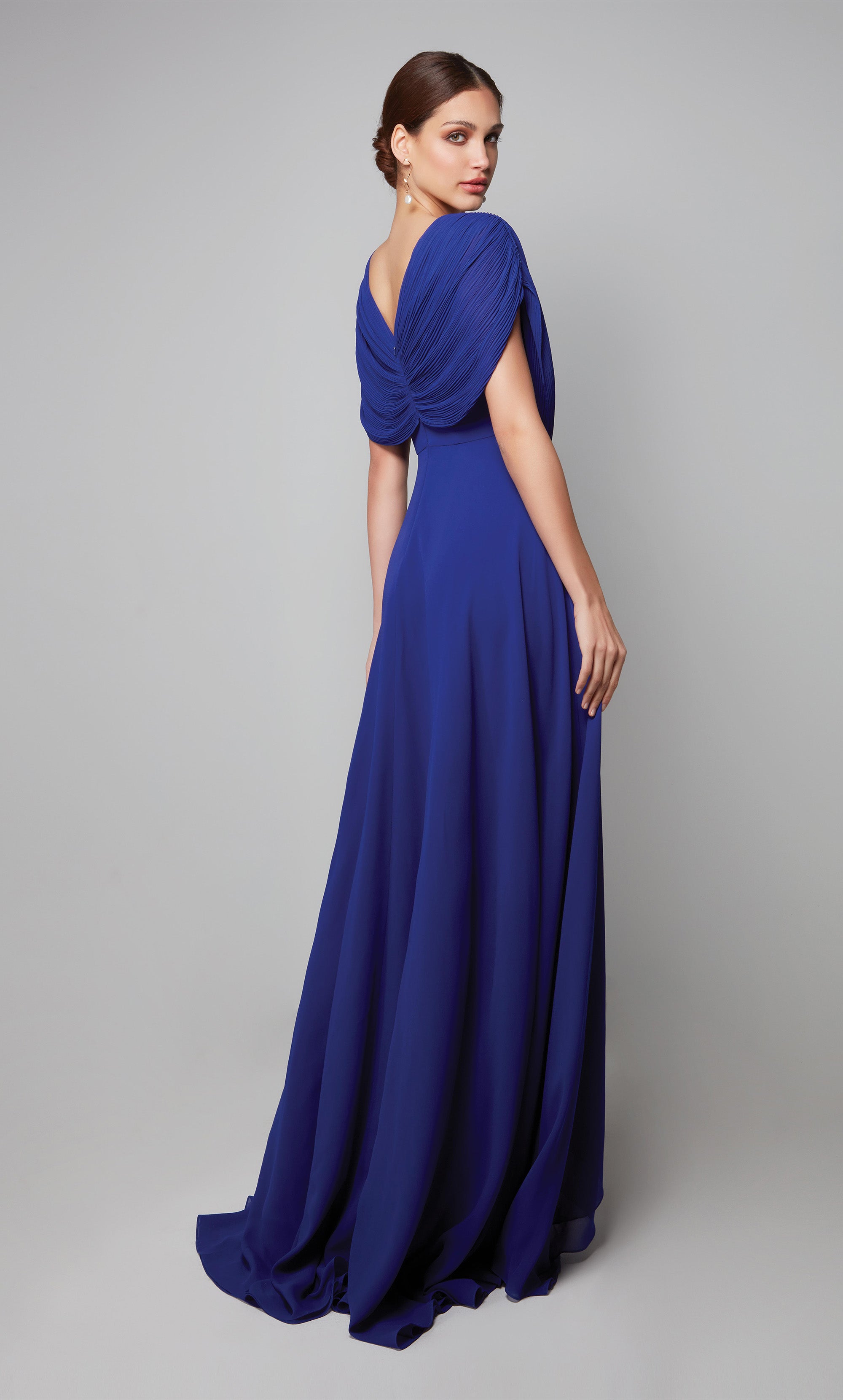 Flowy chiffon gown with a draped top, tiered skirt, and decorative lace applique at the natural waist in cobalt blue. Color-SWATCH_27592__COBALT