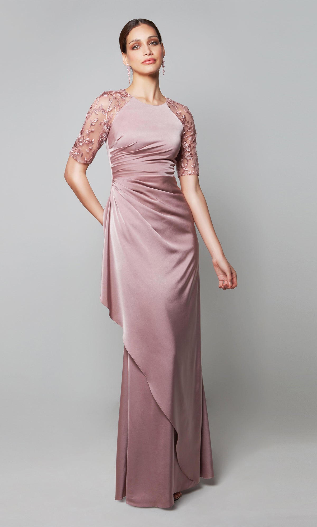 Mother of the bride ruffle dress with a high neck and sheer lace sleeves in light pink.