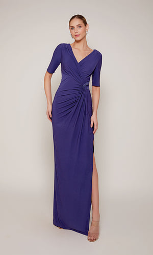 A ruched wedding guest dress with a V-neckline, short sleeves, and a side slit in royal blue.