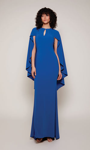 A long, fitted capelet dress with a front key hole and slightly flared skirt from knee to hemline in royal blue.