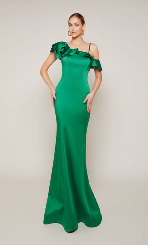 A satin formal dress featuring a one shoulder neckline, a fitted silhouette, and ruffles in emerald green.