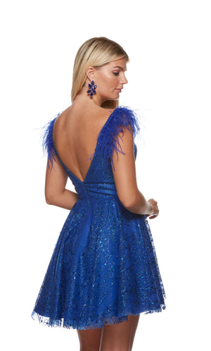 A royal blue, glitter tulle short prom dress with a plunging neckline, open back and featherd cap sleeve.