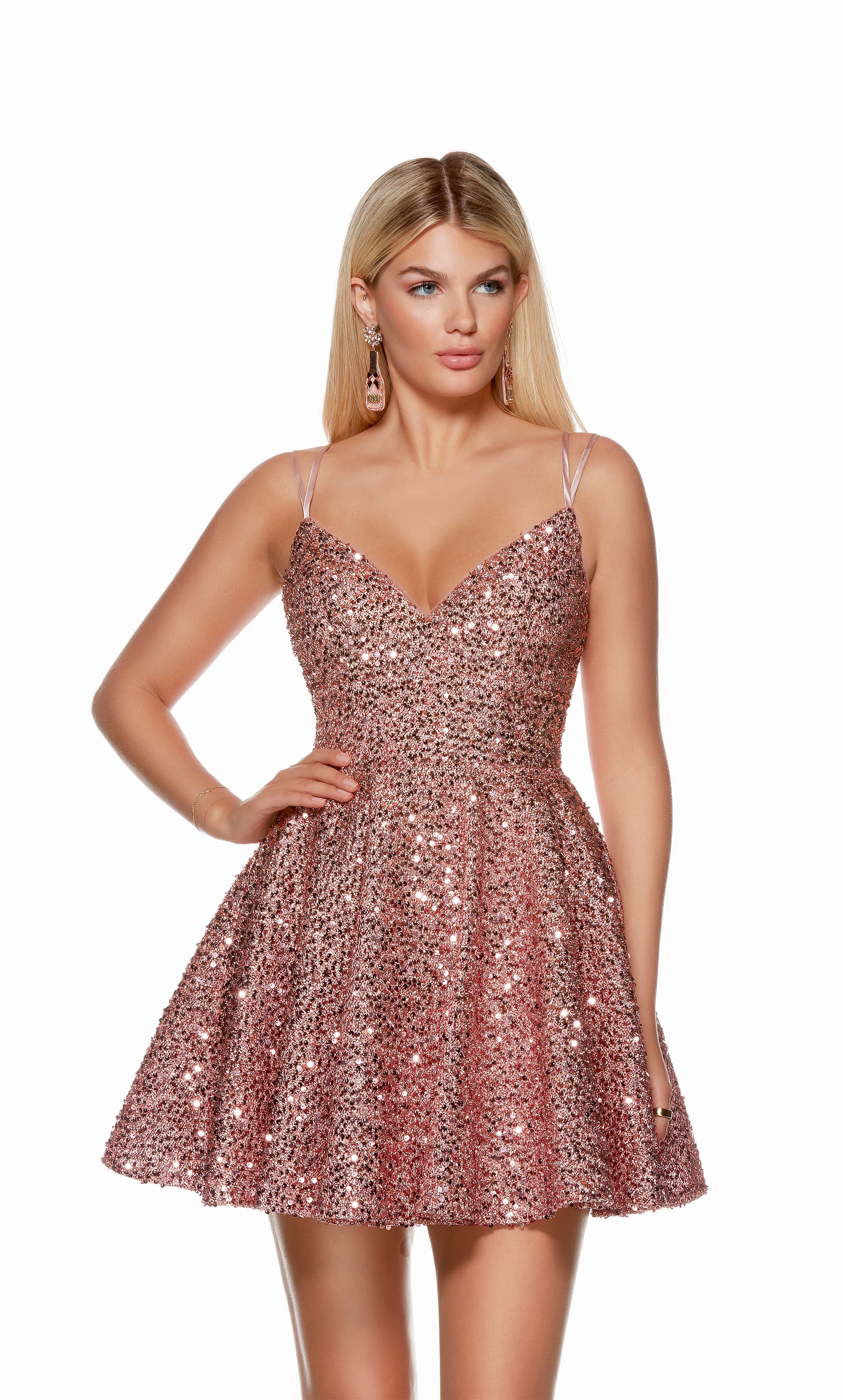 A light mauve, sequin short formal dress highlighting a V neckline, double spaghetti straps, and flared A-line skirt. Shop our latest collection of gorgeous designer dresses by ALYCE Paris.