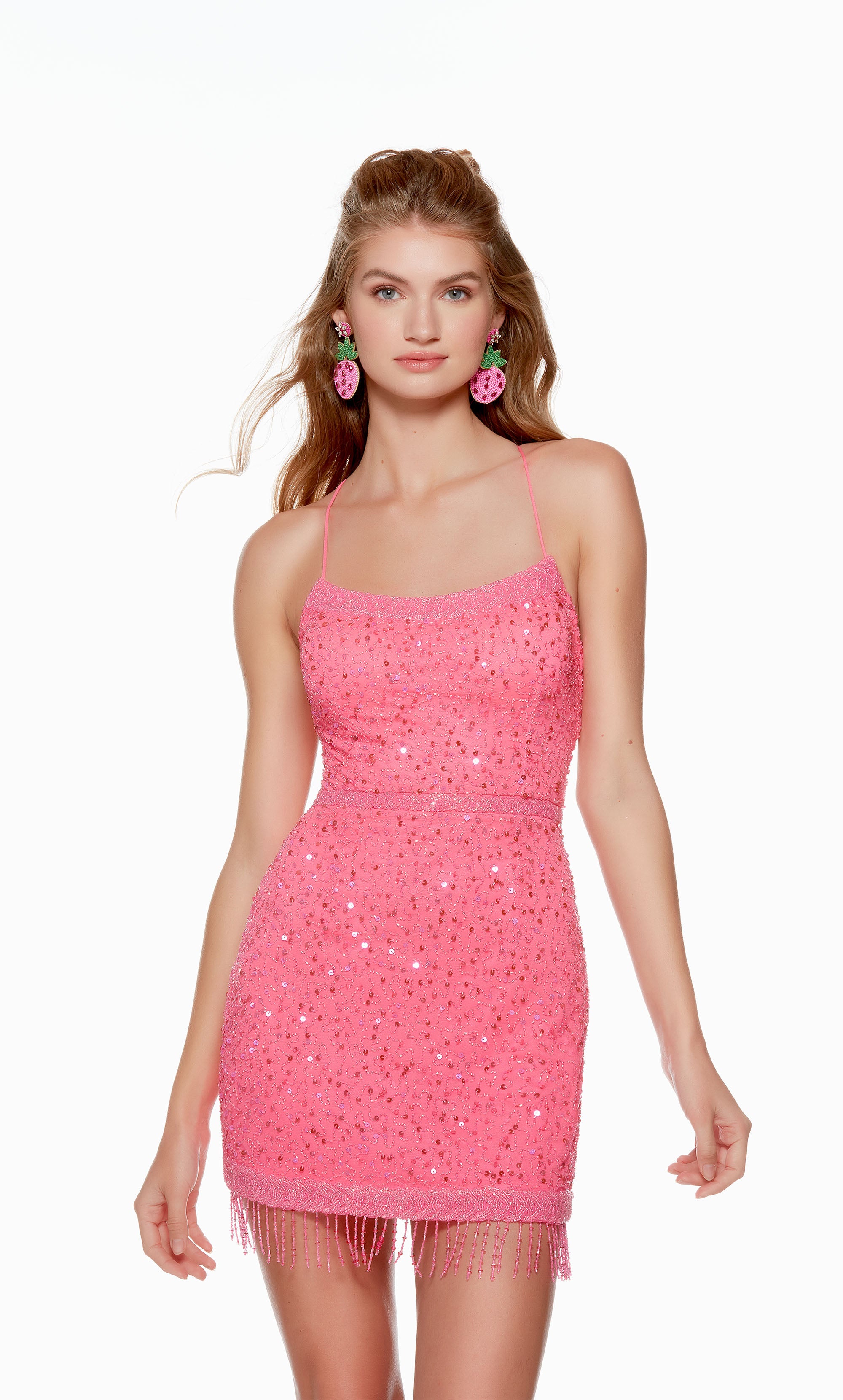 A fun and flirty neon pink short homecoming dress with a scooped neckline and fitted silhouette. The hand-beaded embellishments and fringe detail at the hem take this dress to the next level.