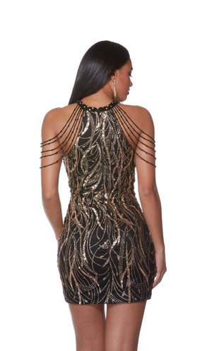 A unique short black dress featuring golden glitter embellishments, a high neckline, and hand-beaded accents.