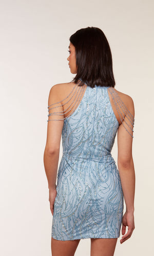 A unique short glacier blue dress featuring golden glitter embellishments, a high neckline, and hand-beaded accents.