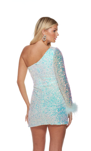 A glamorous white dress crafted from a sparkly, iridescent sequin fabric. The dress spotlights a trendy, one-shoulder neckline, side slit, and feather-trimmed cuff to complete the fun look.