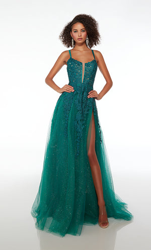 Green prom dress: Plunging corset top, high slit, crisscross strappy back, and train in glitter tulle fabric. Floral lace appliques strategically placed for the perfect touch.