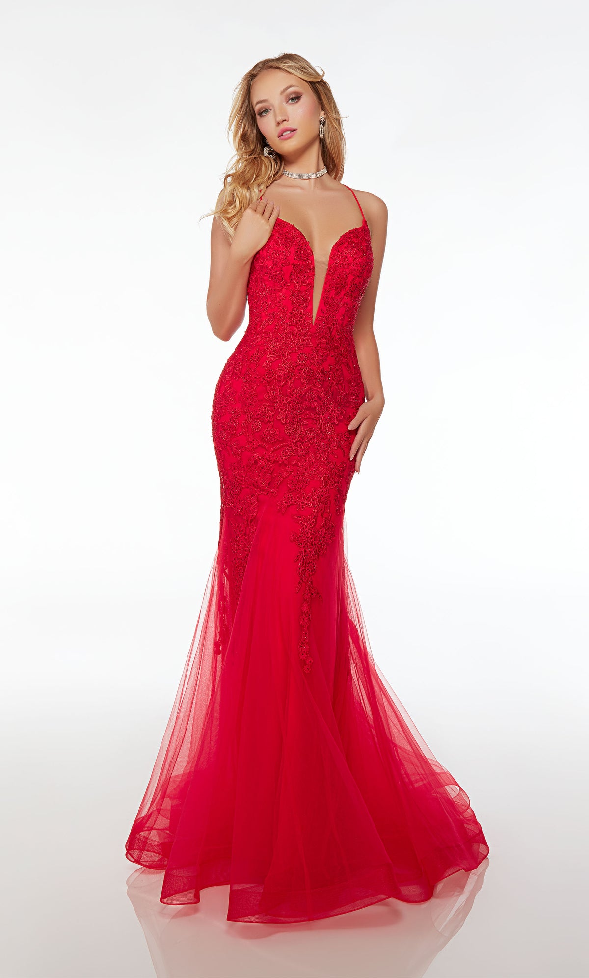 Red mermaid dress with plunging neckline, crisscross lace-up back, and an slight train crafted in tulle and adorned with delicate beaded lace for an elegant and captivating look.