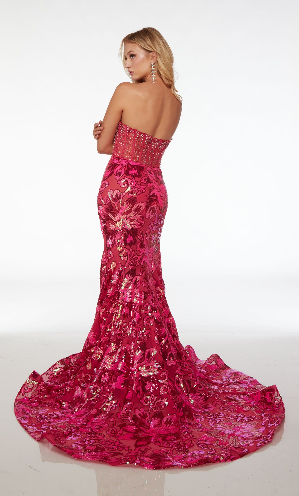 Stunning strapless mermaid dress featuring an sheer rhinestone-embellished corset top and an floral sequin skirt with an gracefully long train.