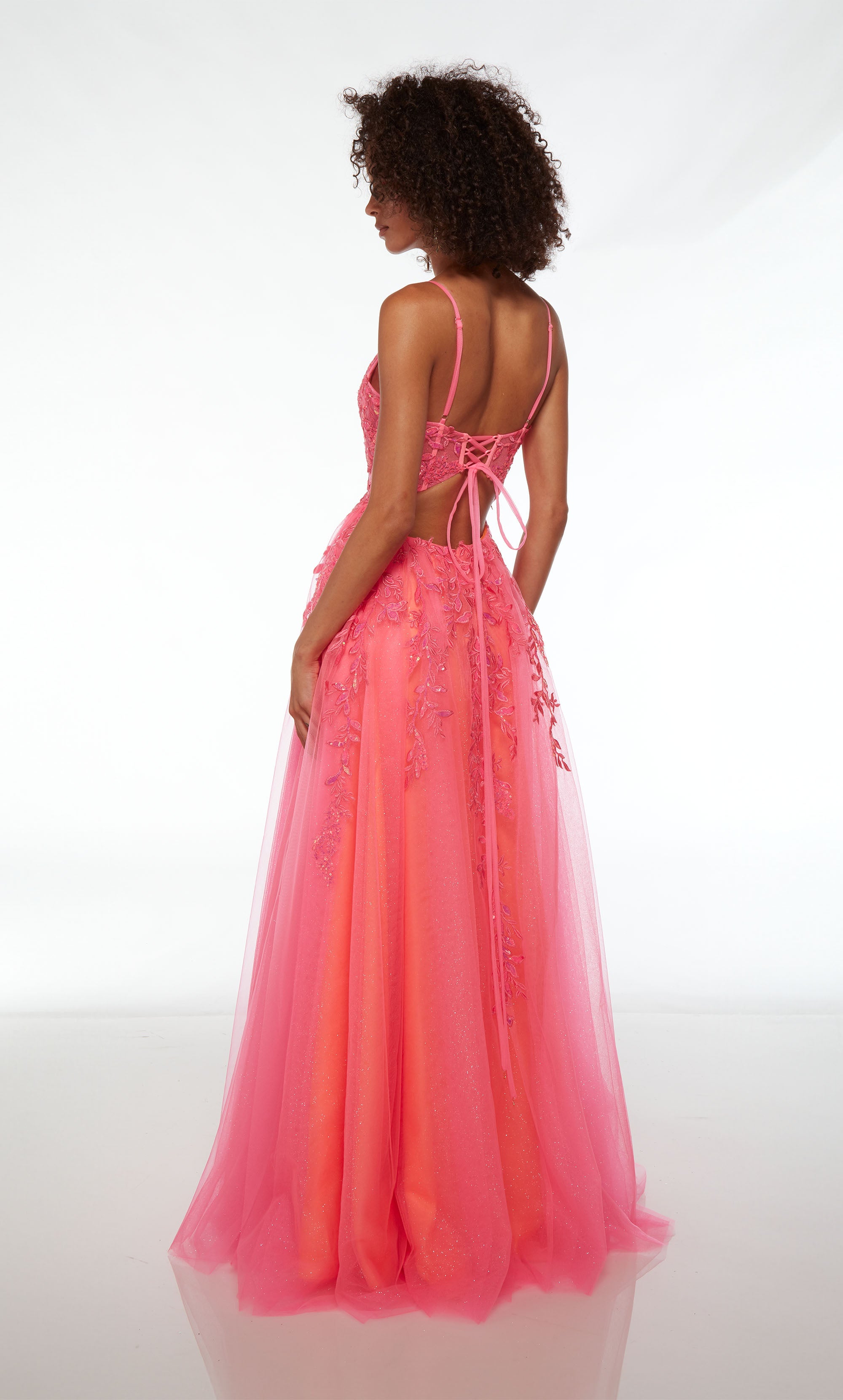 Stunning pink corset prom dress with an V-neckline, delicate floral lace appliques, lace-up back, and an flowy tulle skirt for an enchanting and elegant look.