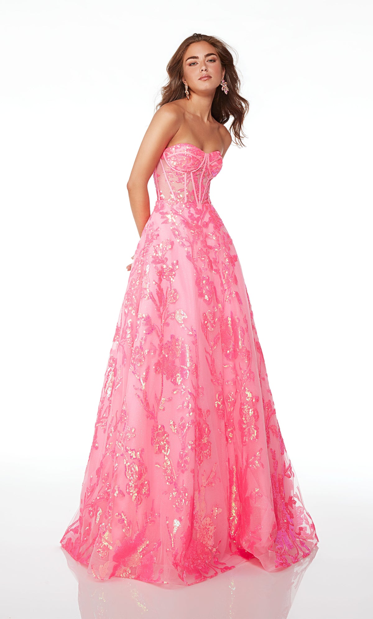 Strapless pink ball gown with an corset top, lace-up back, and iridescent sequin flowers throughout, creating an whimsical and enchanting aesthetic.