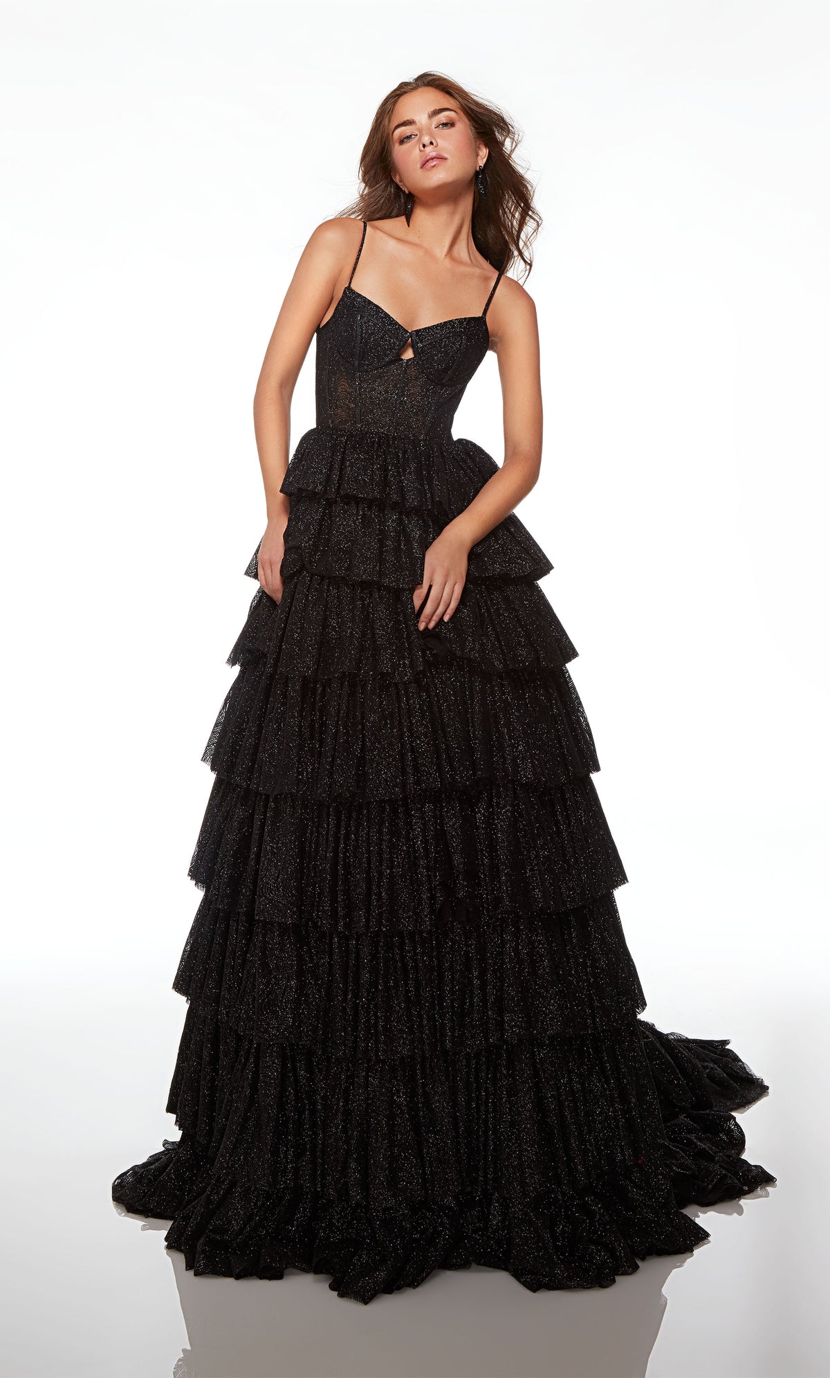 Gorgeous black glitter tulle ball gown featuring an modified sweetheart neckline, corset bodice, and an ruffled skirt with an long, elegant train.