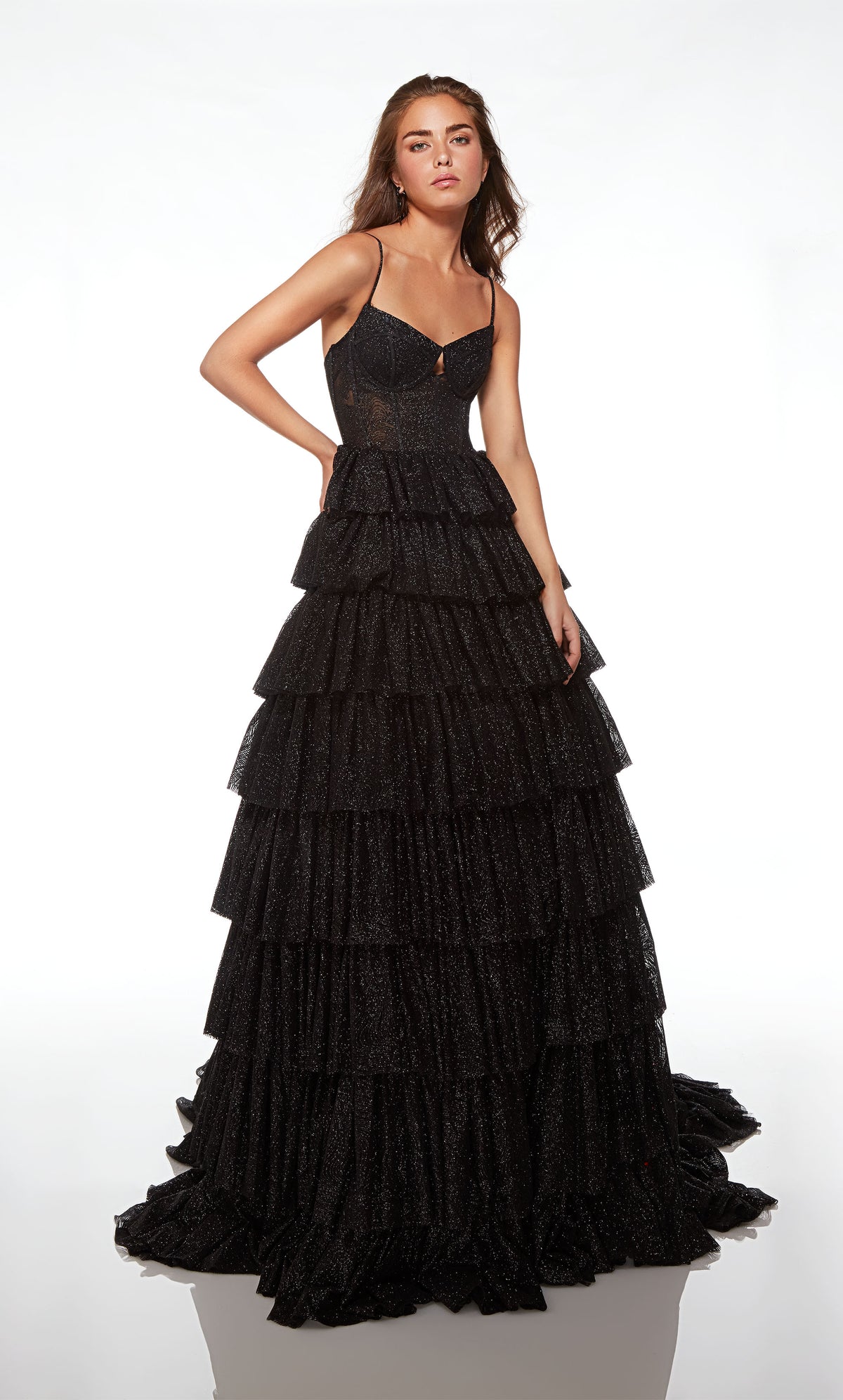 Gorgeous black glitter tulle ball gown featuring an modified sweetheart neckline, corset bodice, and an ruffled skirt with an long, elegant train.