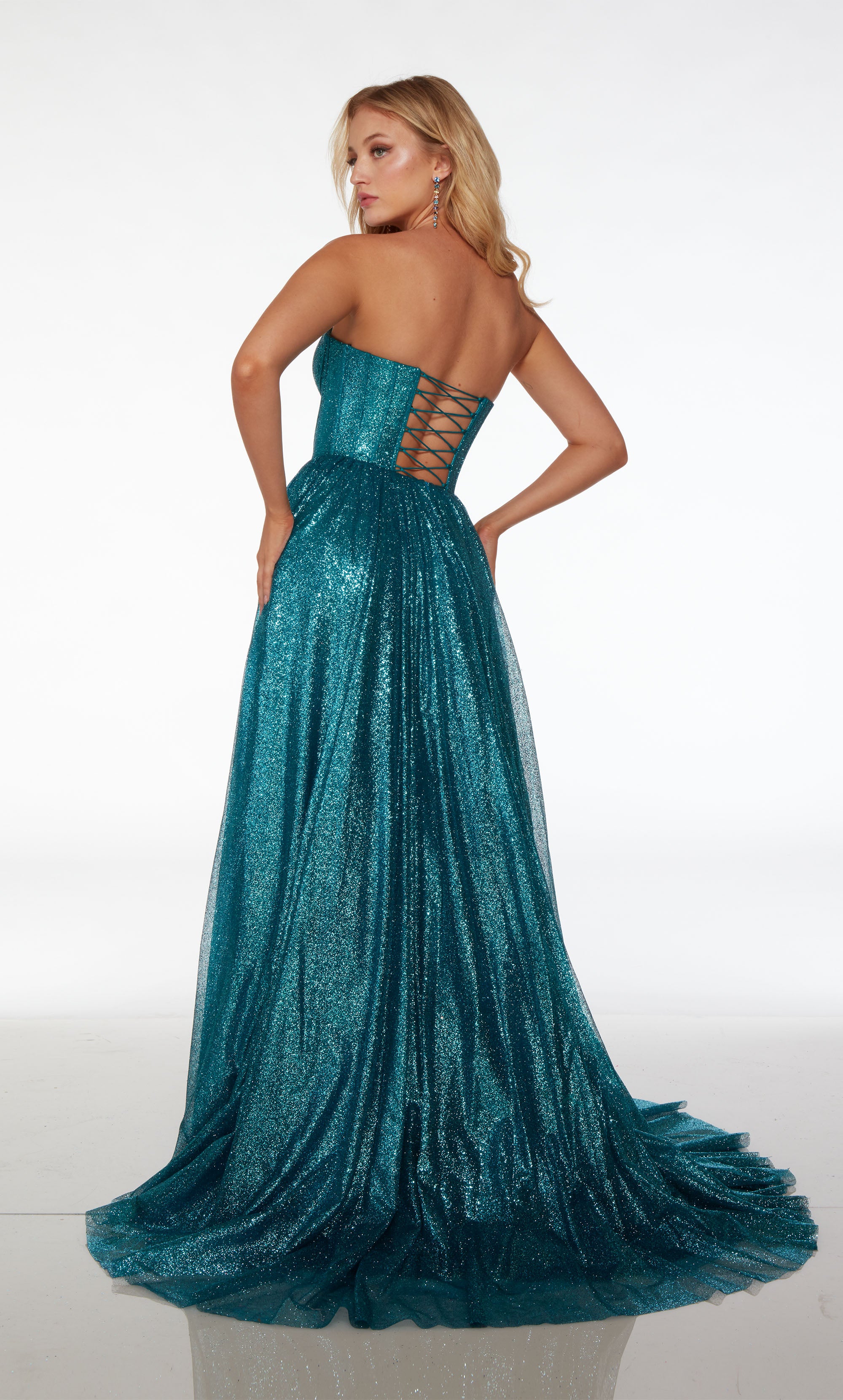 Caribbean blue A-line formal dress in glitter tulle: sweetheart neckline, corset top, side slit, lace-up back, and train for an stylish and elegant look.