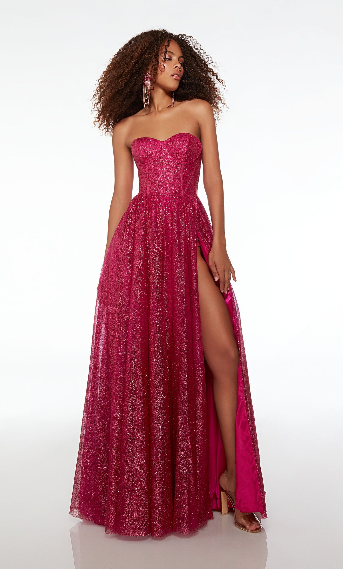 Raspberry pink A-line formal dress in glitter tulle: sweetheart neckline, corset top, side slit, lace-up back, and train for an stylish and elegant look.