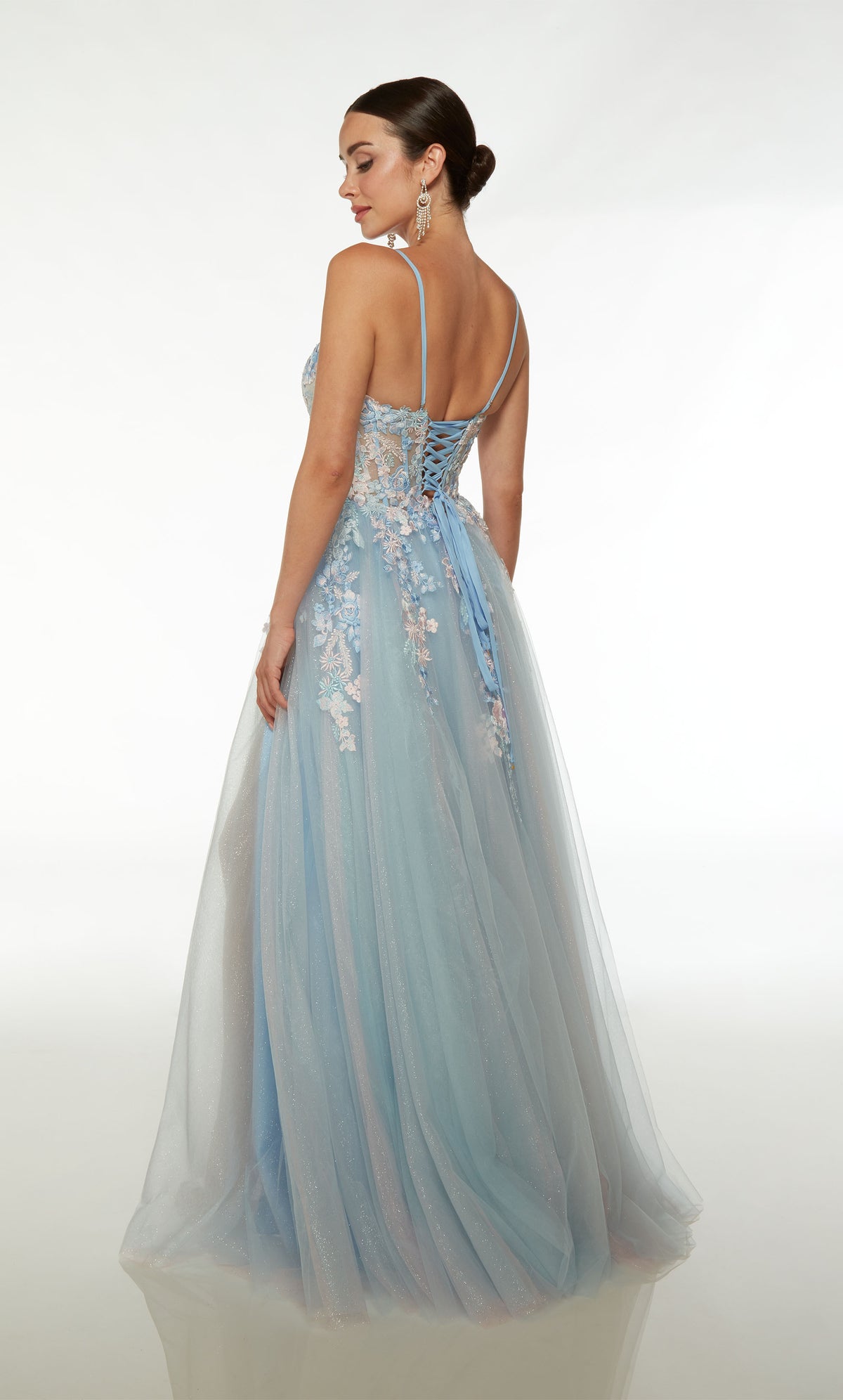 Light blue-pink A-line tulle gown with an sheer corset bodice, high slit, spaghetti straps, lace-up back, slight train, and delicate floral lace appliques.