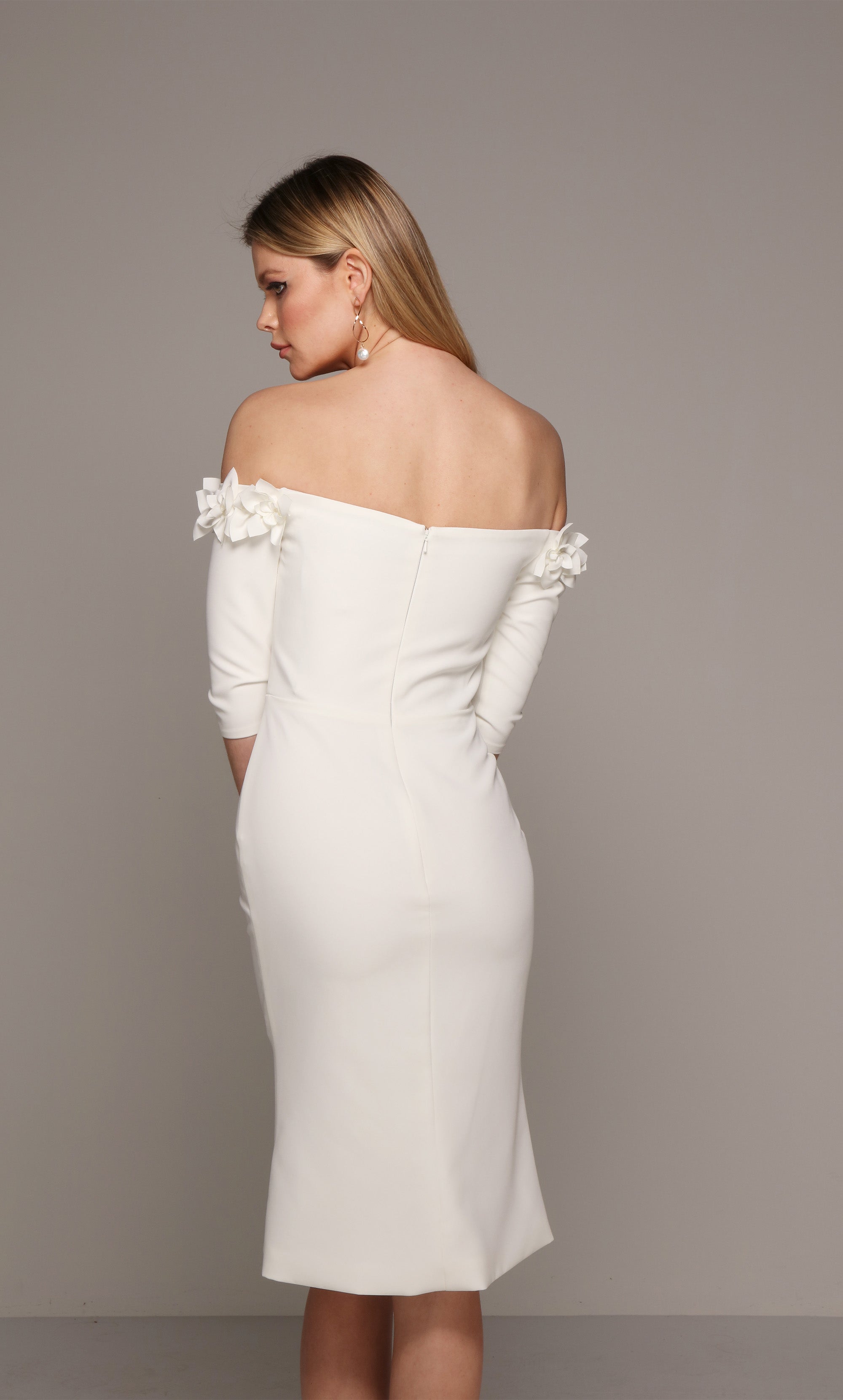 Ivory cocktail midi dress with an off the shoulder bodice enhanced with an airy flower volant. Color-SWATCH_70003__IVORY