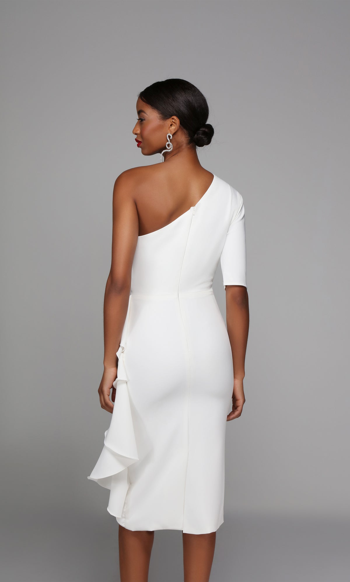 One shoulder white engagement party dress with a zip up back, back slit, and side ruffle.