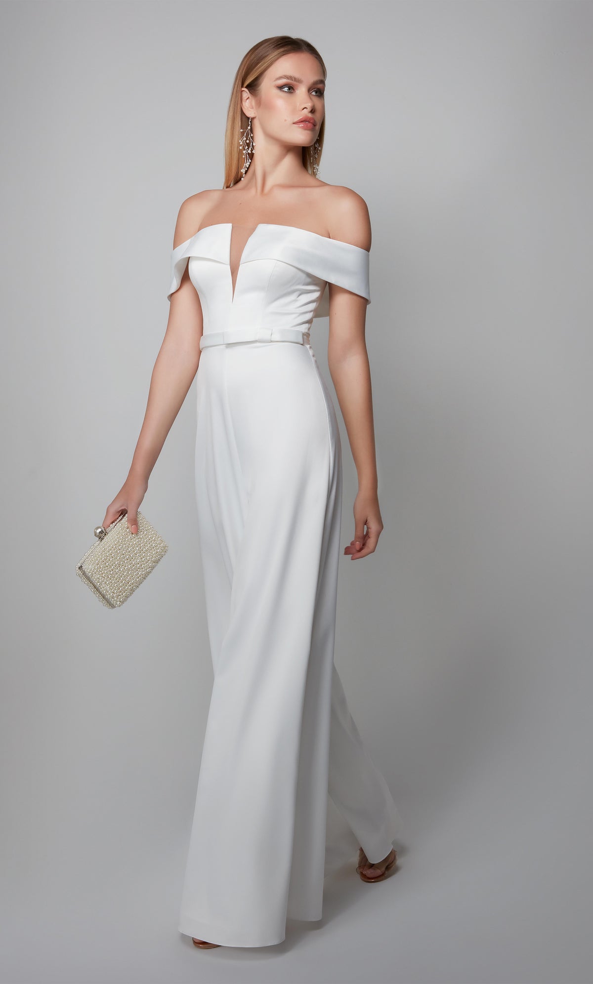 White engagement jumpsuit with an elegant off the shoulder neckline and matching belt at the natural waist. Color-SWATCH_70012__DIAMOND-WHITE