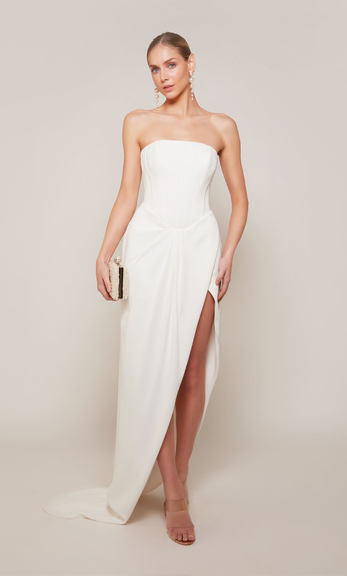 A modern corset engagement dress with a high-low hemline and slight train.