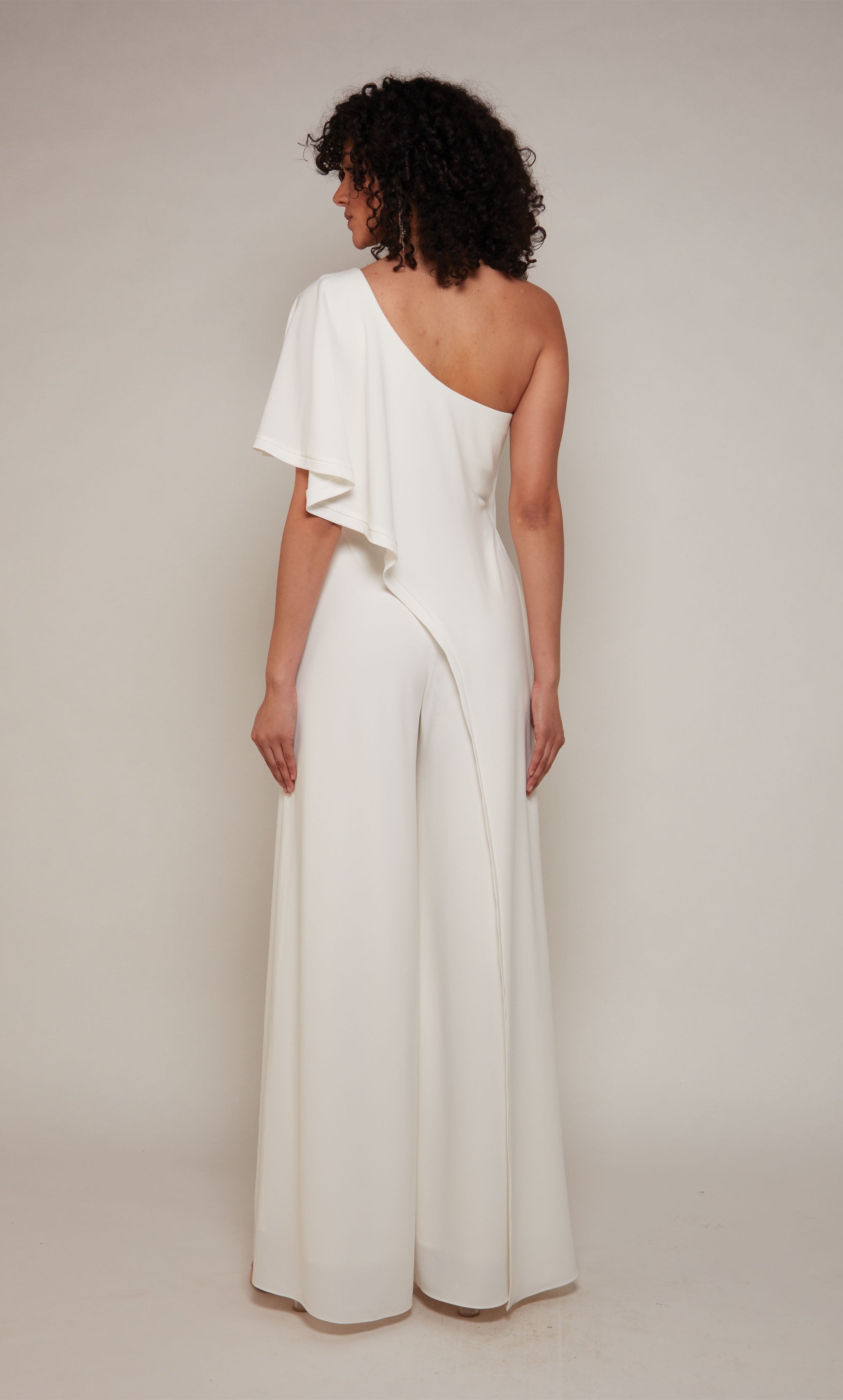 A chic, wide leg jumpsuit with a draped top in ivory.