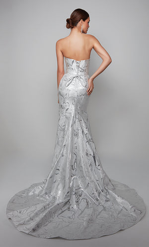 Fit and flare strapless jacquard wedding gown with a lace up back and train in ivory-silver.