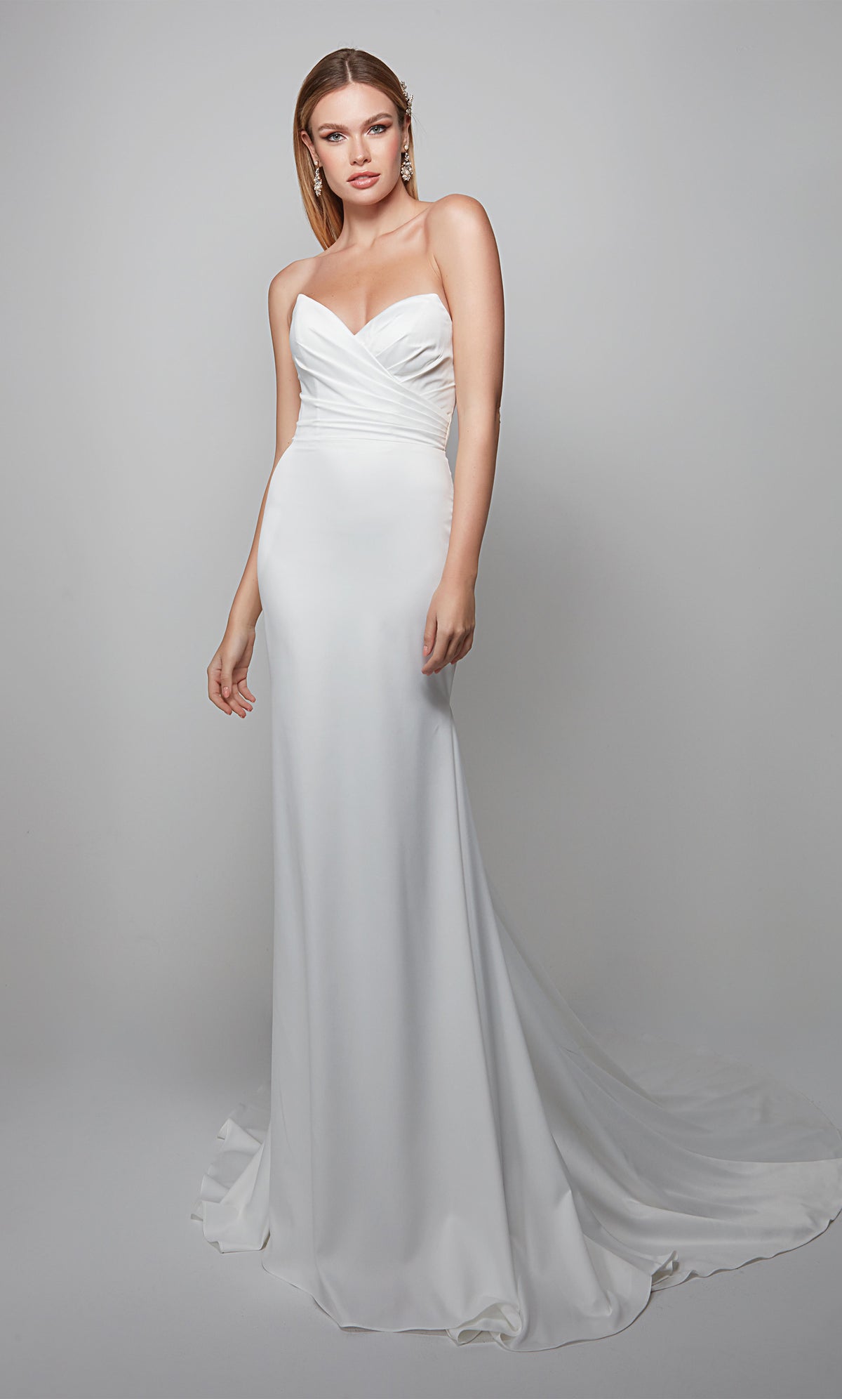 Strapless chic wedding dress with pleated bodice in white.