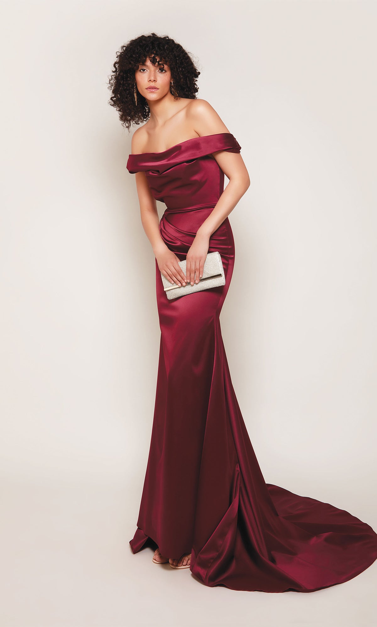 Off the shoulder, duchess satin wedding dress in burgundy.