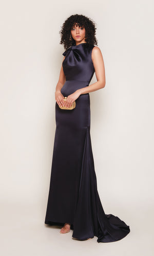 Midnight blue duchess satin gown with an high neckline and fit and flare silhouette.