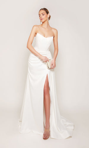 A strapless, corset wedding dress with a ruched waist, an elegant side slit, and detachable side train for a dramatic effect.