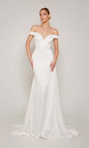 A sophisticated, off-the-shoulder satin wedding dress with a detachable train and satin-covered buttons 