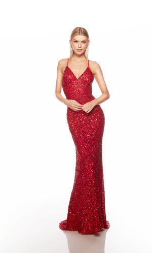 Red sequin gown with an V neckline, slit, and crisscross adjustable strap back, and an slight train for an elegant and alluring look.