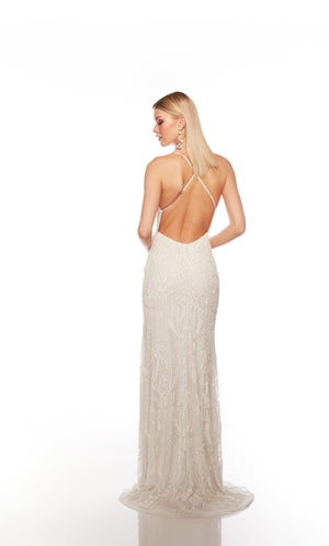 Elegant ivory formal gown: Hand-beaded, V neckline, spaghetti straps, strappy back, and intricate paisley-patterned design for an chic and sophisticated look.